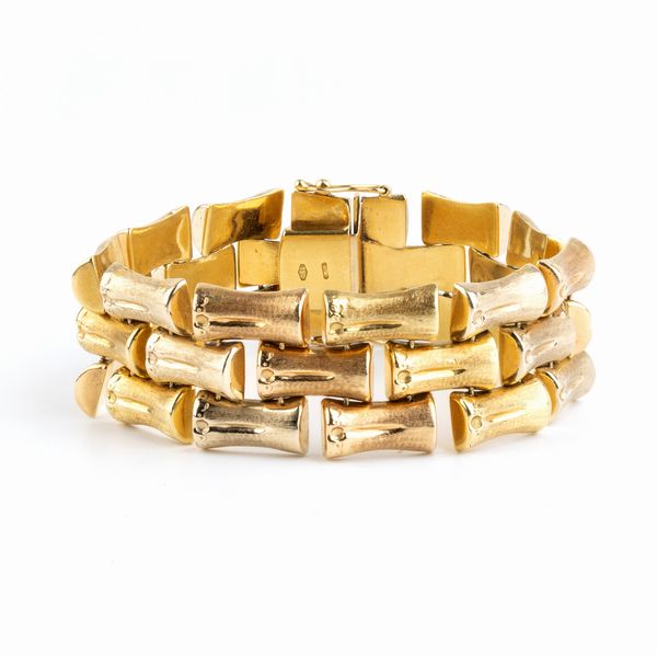 Bracciale in oro con motivo a bamb  - Asta Gioielli e Argenti Moderni e Contemporanei - Associazione Nazionale - Case d'Asta italiane