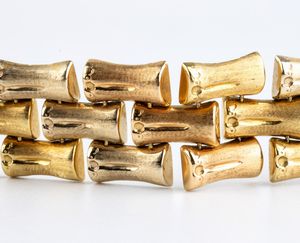 Bracciale in oro con motivo a bamb  - Asta Gioielli e Argenti Moderni e Contemporanei - Associazione Nazionale - Case d'Asta italiane