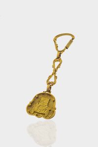 PORTACHIAVI - Peso gr 13 7 in oro giallo lucido e satinato  decorato con macchina d'epoca sul fronte.
