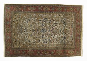 MANIFATTURA PERSIANA DEL XX SECOLO - Tappeto da preghiera con nicchia centrale incorniciata da fascia esterna a motivi geometrici su fondo rosso