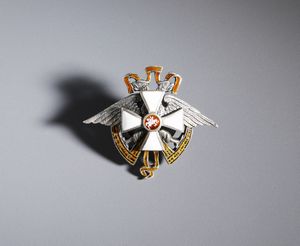 MANIFATTURA RUSSA DEL XX SECOLO - Distintivo in argento e smalti con aquila imperiale e croce dell'Ordine di S. Giorgio, Russia, inizio del XX secolo