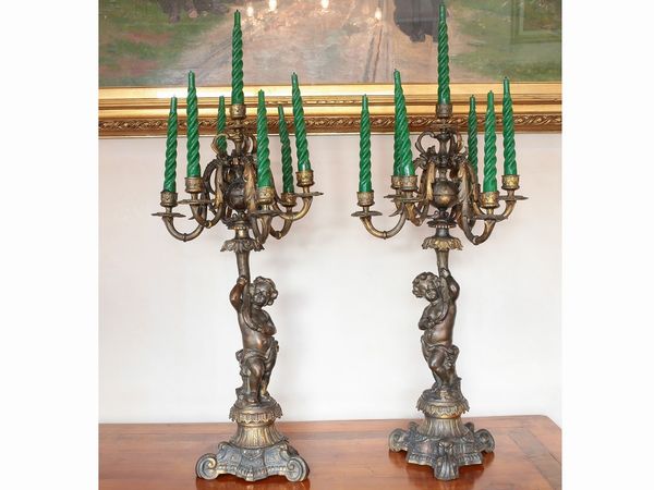 Coppia di candelabri in antimonio dorato e patinato  - Asta Casa Lazzi - parte prima Arredi, dipinti, vetri di Murano, curiosit� - Associazione Nazionale - Case d'Asta italiane