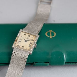 Baume & Mercier : Orologio in oro bianco 18k carica manuale con ghiera in brilllanti, bracciale integrato, 22x20 mm  - Asta Watches - Associazione Nazionale - Case d'Asta italiane