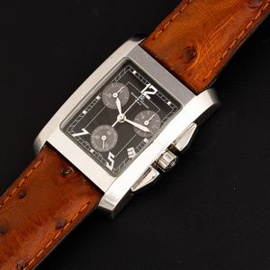 Baume & Mercier : Cronografo rettangolare in acciaio al quarzo, tre contatori, quadrante nero e datario a ore 4, 34x28 mm  - Asta Watches - Associazione Nazionale - Case d'Asta italiane