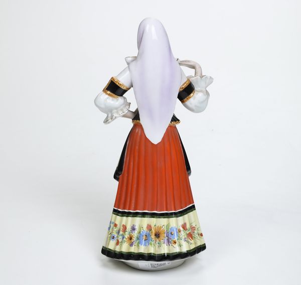 Donna in costume tradizionale.<BR>Torino, Manifattura Antonio Ronzan, 1968-1985.  - Asta Maioliche e Porcellane da Collezione - Associazione Nazionale - Case d'Asta italiane