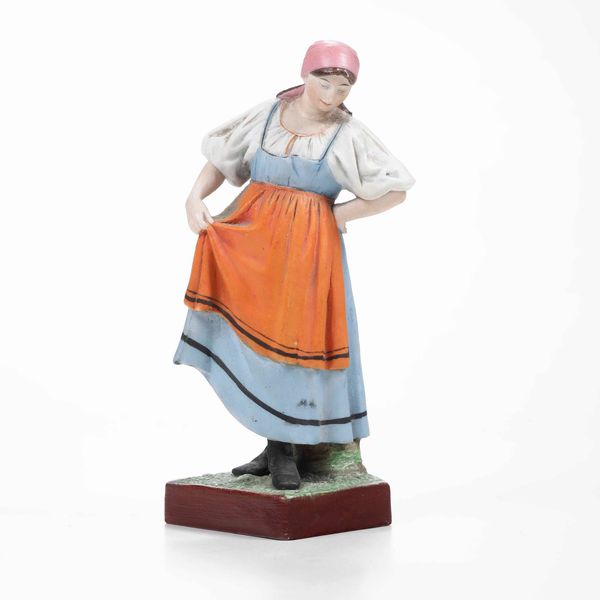 Figurina.<BR>Russia, Verbilki (Mosca), Manifattura Garder, fine del XIX - inizio del XX secolo.<BR>  - Asta Maioliche e Porcellane da Collezione - Associazione Nazionale - Case d'Asta italiane