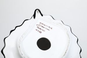 Donna in costume tradizionale.<BR>Torino, Manifattura Antonio Ronzan, 1968-1985.  - Asta Maioliche e Porcellane da Collezione - Associazione Nazionale - Case d'Asta italiane