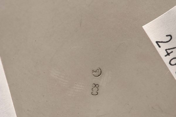 Cestino. Argento fuso e sagomato, manico ad arco in legno ebanizzato. Argenteria artistica italiana del XX secolo  - Asta Argenti - Associazione Nazionale - Case d'Asta italiane