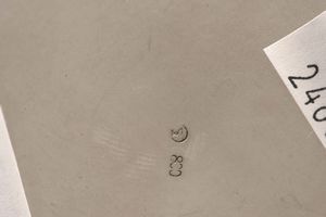 Cestino. Argento fuso e sagomato, manico ad arco in legno ebanizzato. Argenteria artistica italiana del XX secolo  - Asta Argenti - Associazione Nazionale - Case d'Asta italiane