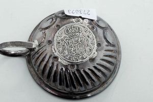 Quattro tastevin. Argento fuso e sbalzato. Manifatture diverse, XIX-XX secolo  - Asta Argenti - Associazione Nazionale - Case d'Asta italiane