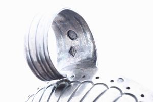 Quattro tastevin. Argento fuso e sbalzato. Manifatture diverse, XIX-XX secolo  - Asta Argenti - Associazione Nazionale - Case d'Asta italiane