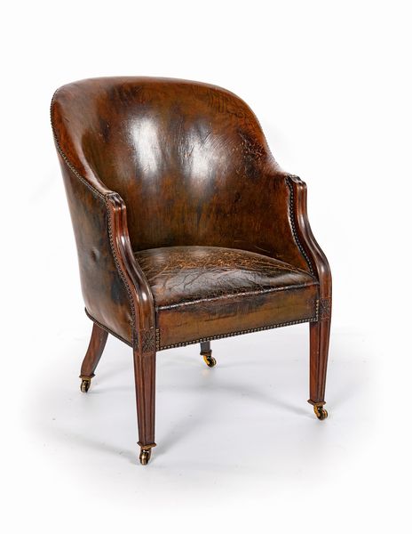 Poltrona a pozzetto in noce rivestita in cuoio, Inghilterra, met� del XIX secolo  - Asta La Collezione Enrico e Antonello Falqui. Di padre in figlio una vita nell'arte. - Associazione Nazionale - Case d'Asta italiane
