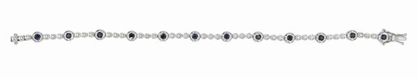 Bracciale tennis in oro bianco, brillanti e zaffiri  - Asta Importanti Gioielli e Orologi da polso e da tasca - Associazione Nazionale - Case d'Asta italiane