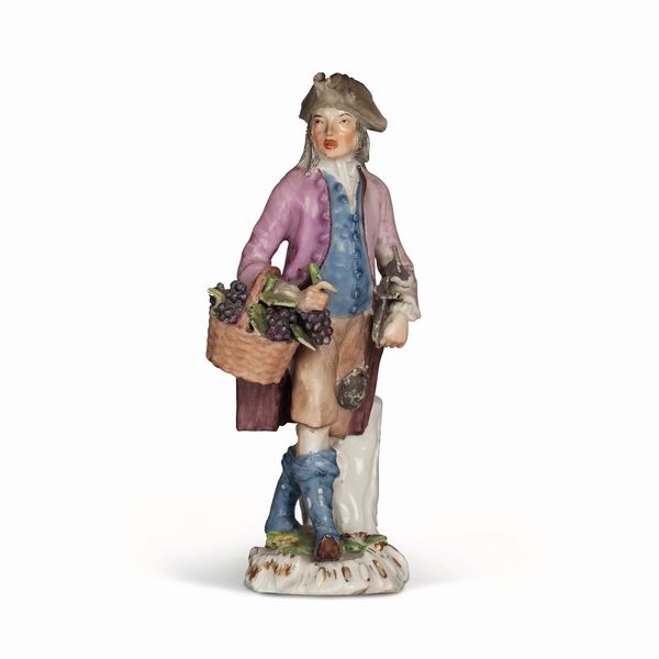 Figurina “Venditore di uva”<BR>Meissen, 1750 circa<BR>Modello di Peter Reinicke, 1753-1754<BR>  - Asta Maioliche e Porcellane da Collezione - Associazione Nazionale - Case d'Asta italiane