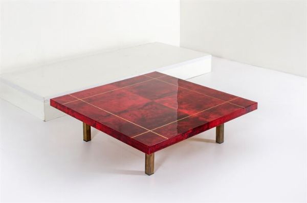 TURA ALDO : Tavolino con piano rivestito in pergamena vetrificata  sostegni in metallo. Anni '50 cm 31x103x103  - Asta Asta 147 Design - Associazione Nazionale - Case d'Asta italiane