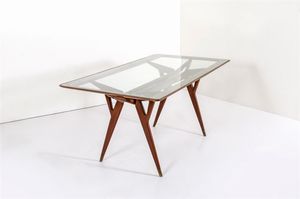 PRODUZIONE ITALIANA - Tavolo in legno di noce  piano in vetro molato. Anni '50 cm 79x201x92 5