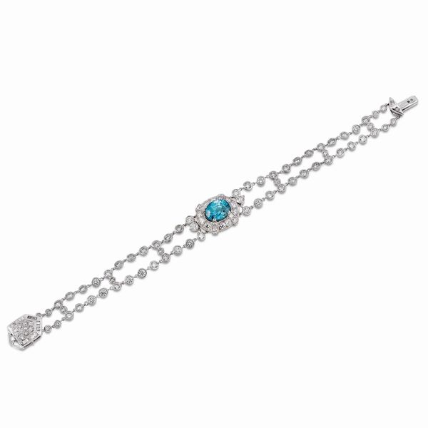 BRACCIALE A FASCIA CON ZIRCONE BLU NATURALE E DIAMANTI  - Asta GIOIELLI - Associazione Nazionale - Case d'Asta italiane