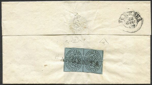 1859, Romagne, francobolli di Pontificio usati nelle Romagne - Lettera da Argenta per Ferrara del 18 giugno 1859, dopo la costituzione del G. Provvisorio, affrancata al verso con coppia verticale del francobollo pontificio da 1/2 baj grigio (Sass. 1), in tariffa per lettere scambiate entro la stessa Direzione. Al verso bollo di arrivo a Ferrara del giorno stesso. Coppia lievemente toccata in alcuni tratti sui filetti verticali, ma di ottimo aspetto e molto rara. Il 14 giugno, in Argenta  dichiarato decaduto il Governo Pontificio e si costituisce un Governo Provvisorio che invoca la dittatura di Vittorio Emanuele II.  - Asta Filatelia e Storia Postale - Associazione Nazionale - Case d'Asta italiane