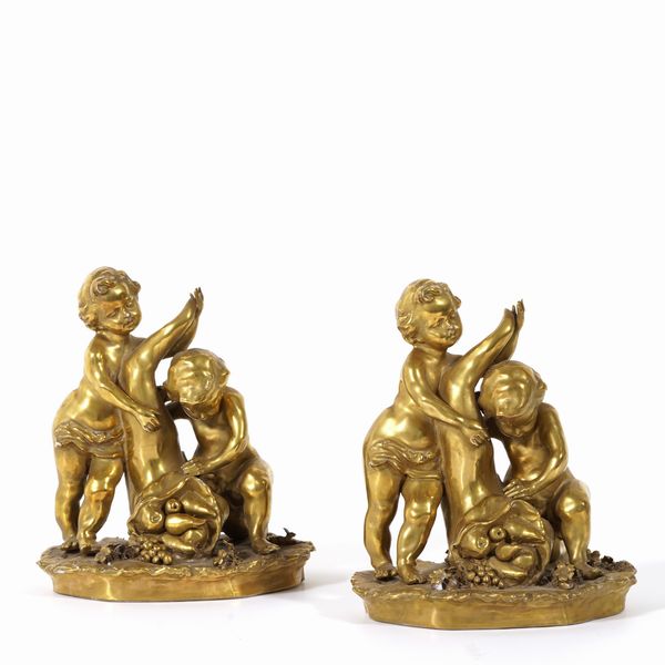 Coppia di putti allegoria dell�Abbondanza, XX secolo.<BR>  - Asta Maioliche, Porcellane e Vetri - Associazione Nazionale - Case d'Asta italiane