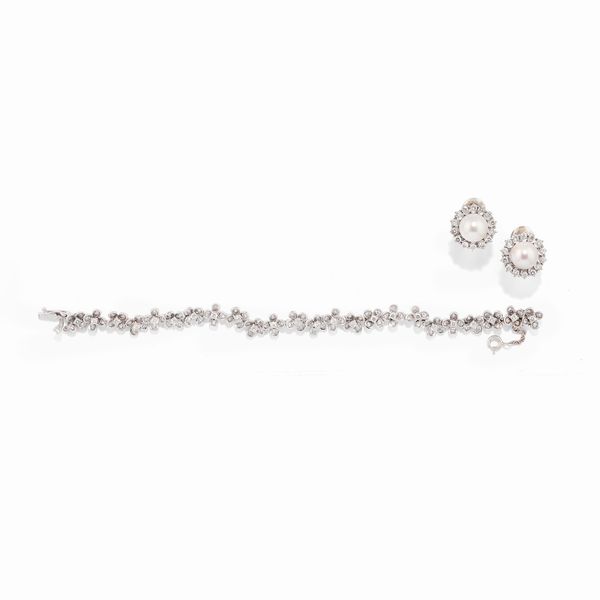 Coppia di orecchini e bracciale con diamanti  - Asta Gioielli - Associazione Nazionale - Case d'Asta italiane