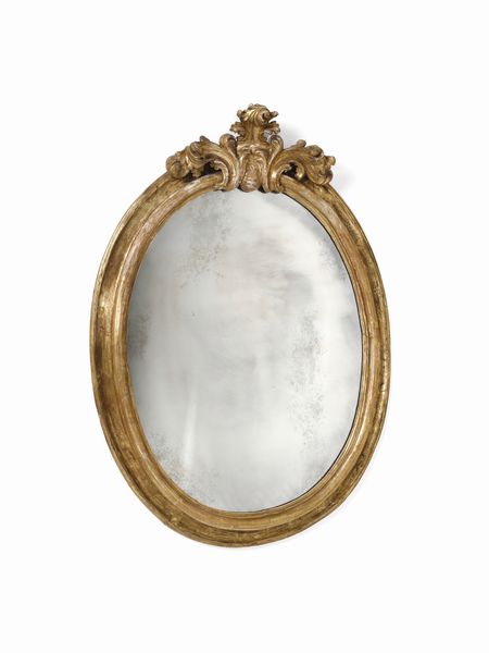 MANIFATTURA DEL XVIII SECOLO : Specchiera di forma ovale in legno intagliato e dorato con cimasa a decoro fitomorfo  - Asta Asta 502 | ARTE ANTICA E DEL XIX SECOLO Online - Associazione Nazionale - Case d'Asta italiane