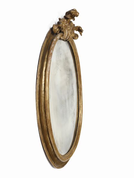 MANIFATTURA DEL XVIII SECOLO : Specchiera di forma ovale in legno intagliato e dorato con cimasa a decoro fitomorfo  - Asta Asta 502 | ARTE ANTICA E DEL XIX SECOLO Online - Associazione Nazionale - Case d'Asta italiane
