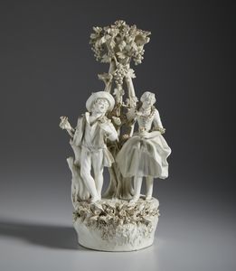 MANIFATTURA ANTONIBON, BASSANO, XIX SECOLO - Gruppo in terraglia smaltata raffigurante una coppia galante sotto un albero di vite