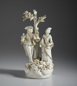 MANIFATTURA DI BASSANO DEL XIX SECOLO - Gruppo in terraglia smaltata raffigurante una scena galante con coppia di personaggi sotto a un albero