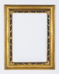 MANIFATTURA DEL XX SECOLO - Cornice in legno intagliato, dorato e parzialmente ebanizzato in stile seicentesco
