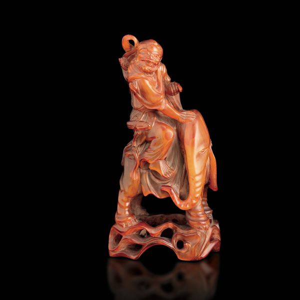 Figura di personaggio ed elefante in ambra, Cina, XIX secolo  - Asta Fine Asian Works of Art - Associazione Nazionale - Case d'Asta italiane