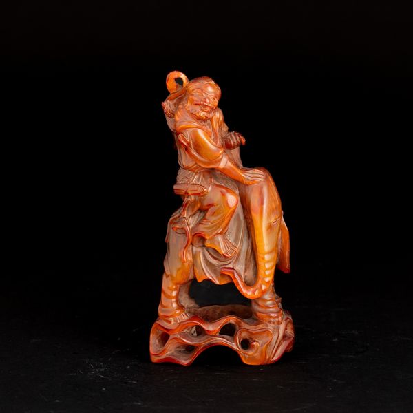 Figura di personaggio ed elefante in ambra, Cina, XIX secolo  - Asta Fine Asian Works of Art - Associazione Nazionale - Case d'Asta italiane