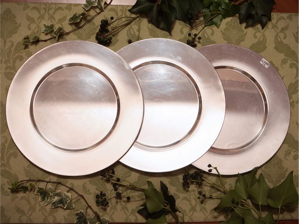 Serie di dodici sottopiatti in metallo argentato, Cassetti Firenze  - Asta Due case fiorentine - Associazione Nazionale - Case d'Asta italiane