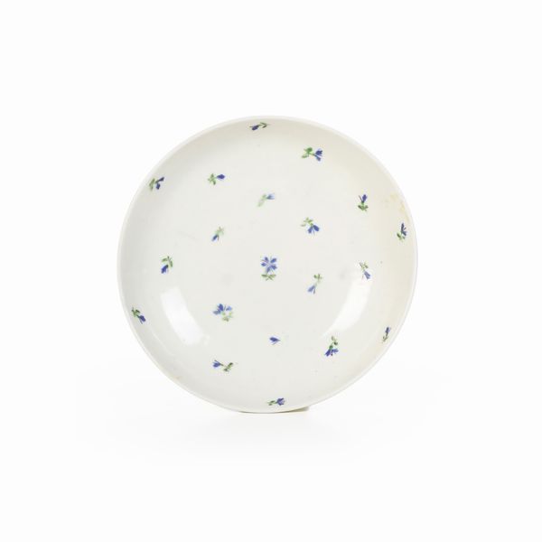 Piattino.<BR>Torino, Manifattura di Vinovo, periodo Lomello, 1815 -1825.  - Asta Maioliche e Porcellane - Associazione Nazionale - Case d'Asta italiane