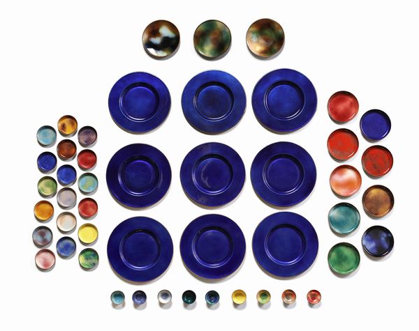 DE POLI PAOLO (1905 - 1996) : Lotto composto da nove sottopiatti, tre sottobottiglia, nove piatti pane, diciotto sottobicchieri e nove portaburro, Padova  - Asta Asta 516 | DESIGN E ARTI DECORATIVE DEL NOVECENTO Online - Associazione Nazionale - Case d'Asta italiane