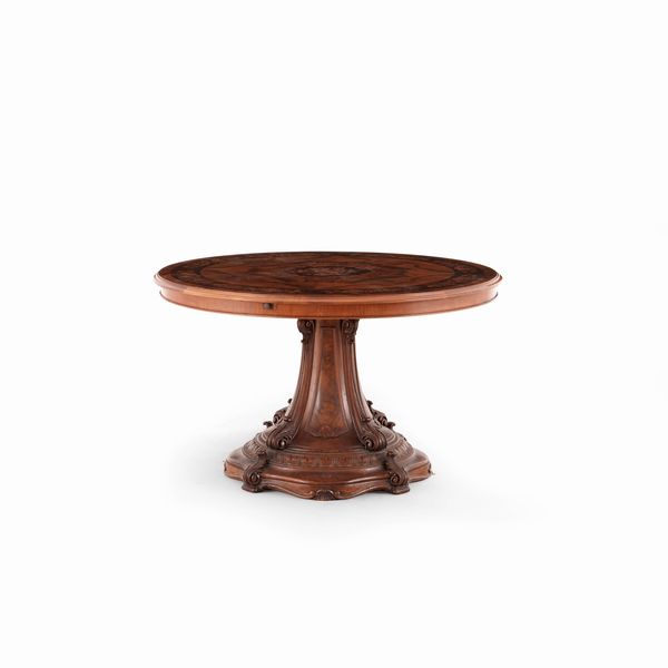 Tavolo circolare in lagno intagliato, lastronato ed intarsiato. XIX secolo  - Asta Antiquariato - Associazione Nazionale - Case d'Asta italiane