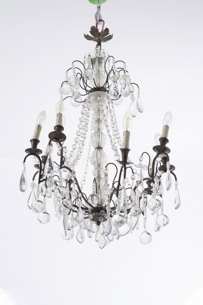 Lampadario con fusto vetro e nove bracci in metallo. XX secolo  - Asta Antiquariato - Associazione Nazionale - Case d'Asta italiane