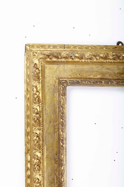 Cornice a cassetta in legno intagliato, bulinato e dorato. Emilia XVII secolo  - Asta Cornici antiche - Associazione Nazionale - Case d'Asta italiane