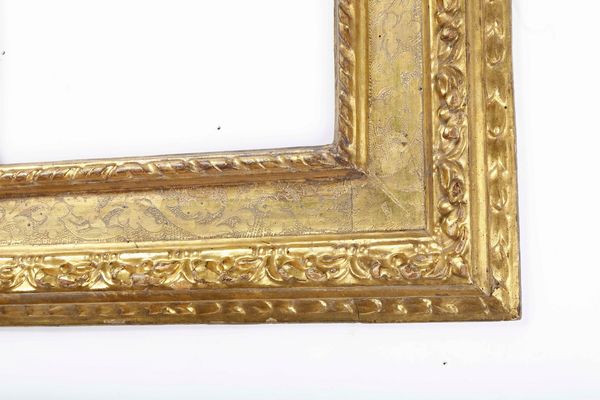 Cornice a cassetta in legno intagliato, bulinato e dorato. Emilia XVII secolo  - Asta Cornici antiche - Associazione Nazionale - Case d'Asta italiane