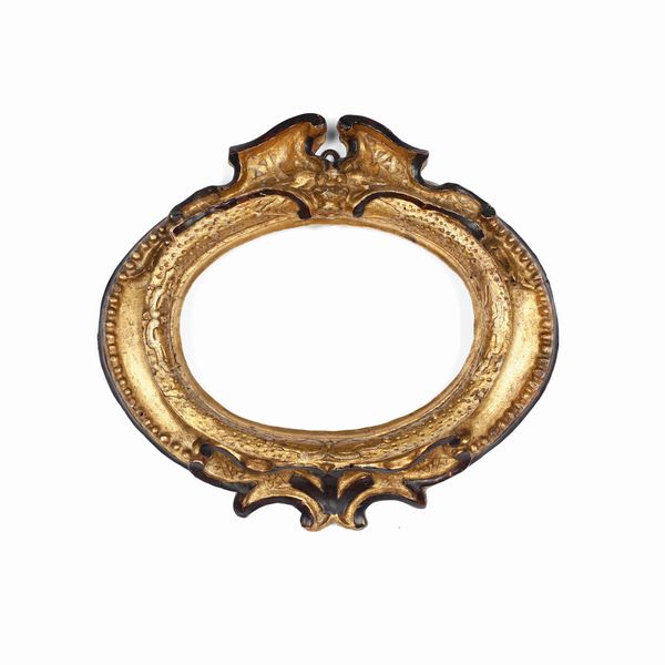 Cornice in legno intagliato, dorato con profili ebanizzati. Italia centrale XVII-XVIII secolo  - Asta Cornici antiche - Associazione Nazionale - Case d'Asta italiane