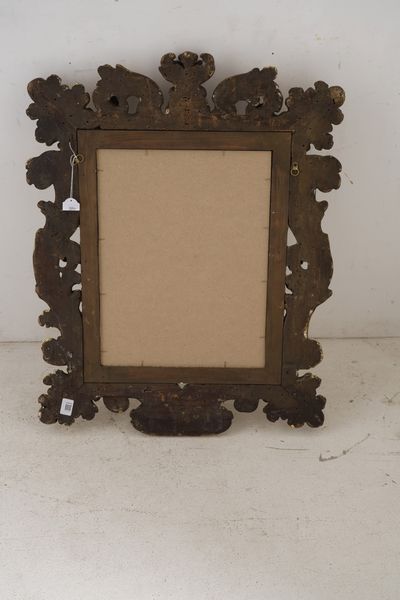 Cornice in legno riccamente intagliato a volute fogliate e dorato. XIX secolo  - Asta Cornici antiche - Associazione Nazionale - Case d'Asta italiane