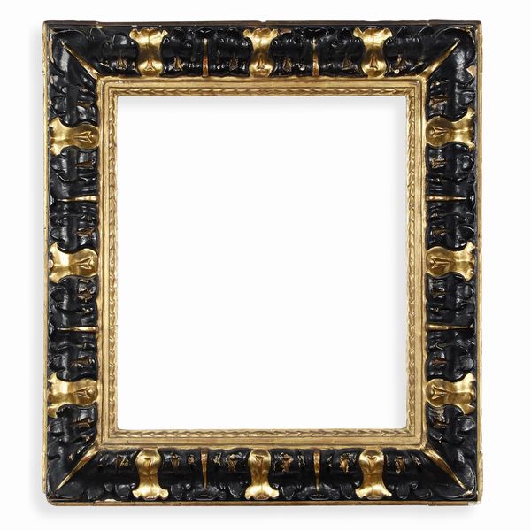 Cornice in legno modanato, intagliato, ebanizzato e dorato. Centro Italia XVII secolo  - Asta Cornici antiche - Associazione Nazionale - Case d'Asta italiane