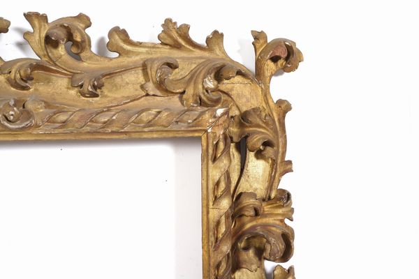 Grande cornice in legno intagliato e dorato a motivi vegetali. Emilia XVII-XVIII secolo  - Asta Cornici antiche - Associazione Nazionale - Case d'Asta italiane