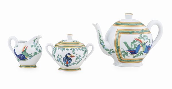 Teiera, lattiera e zuccheriera Herms Tucano.<BR>Francia, Manifattura di Limoges, fine XX - inizio XXI secolo.  - Asta Dimore Italiane - Associazione Nazionale - Case d'Asta italiane