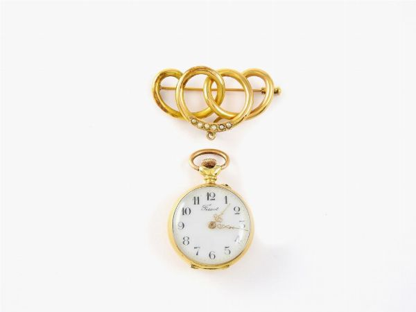 Spilla orologio Tissot per donna in oro giallo e mezze perle  - Asta Orologi e Gioielli - I - Associazione Nazionale - Case d'Asta italiane
