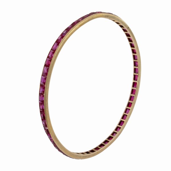 Bracciale a manetta in oro giallo 18kt e rubini  - Asta Gioielli e Orologi - Associazione Nazionale - Case d'Asta italiane
