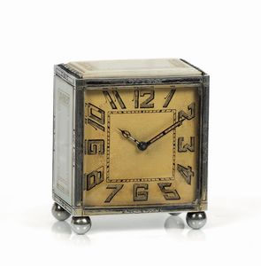 Anonimo - Anonimo. Piccolo orologio da tavolo, in argento e avorio. Realizzato nel 1920 circa