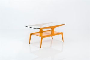 Ponti Gio - Tavolino in legno di frassino  piano in cristallo. Anni '40 cm 47x96x45 Bibl.: P. Piccione  Gio Ponti  Le navi  [..]