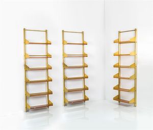 FEAL - Tre librerie con montanti in metallo  ripiani in legno di teak regolabili in altezza. Fine anni '50  primi anni  [..]