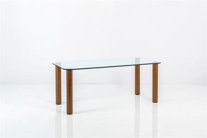 ZANUSO MARCO - Tavolo con piano in cristallo  gambe in acciaio e legno. Prod. Zanotta fine anni '60 cm 72x180x80