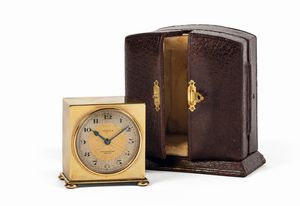 ZENITH - ZENITH, Eberhard Milan, piccolo orologio da viaggio in ottone dorato con funzione di sveglia. Accompagnato dalla scatola originale. Realizzato nel 1930 circa